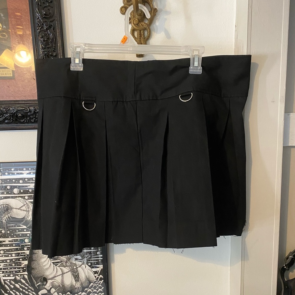 black pleated mini skirt